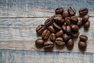 roasted coffee beans on wooden background