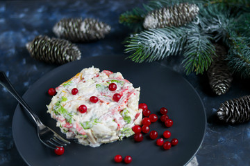 Salad of crackers, Peking cabbage, sweet pepper, hard cheese, balyk. Dressed with mayonnaise sauce. Garnished with cranberries. Festive, New Year's dish. High-calorie, nutritious. Copy space. 