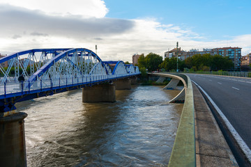 Fototapeta na wymiar Zaragoza, Spain/Europe; 12/1/2019: Pillar Bridge or Iron Bridge (Puente de Hierro) in Zaragoza, Spain