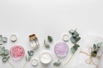 Colored aroma sea salt with handmade cream on white