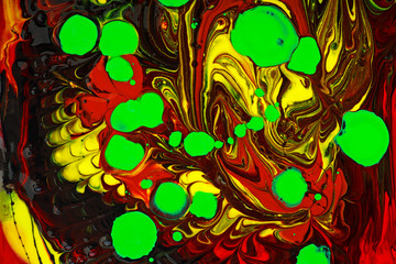 Macro close up of different color oil paint. Mixed liquid paints. Abstract background.