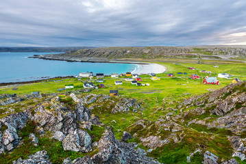 View at abandoned fishers’ village Hamningberg and the shore of the Barents Sea as viewed from the fort. Finnmark, Norway.