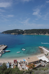 The small port of the island of San Nicola and in the background the island of San Domino. Tremiti islands, Adriatic sea, Puglia, Italy