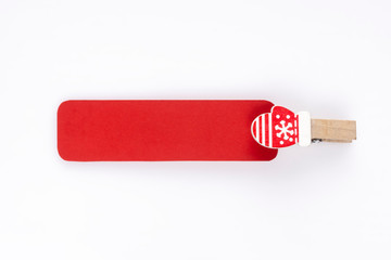 Empty red paper tag with a little christmas mitten holding it