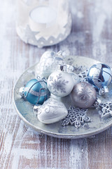Christmas baubles on bright wooden background. 