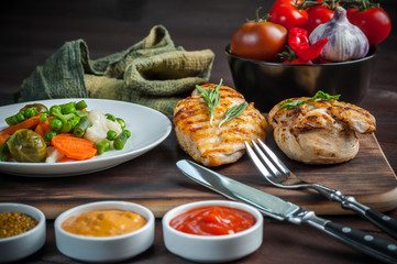 Fried chicken fillet and boiled vegetables