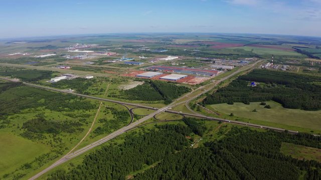 modern road junction near industrial complex bird eye view