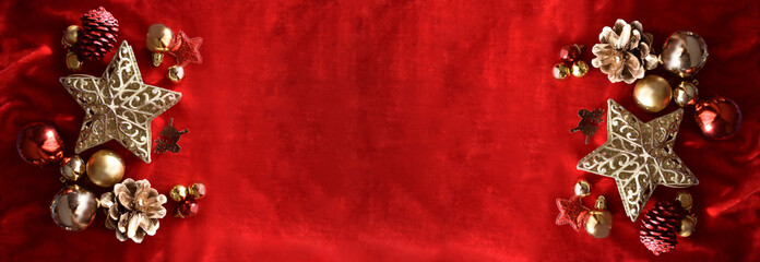 golden end of the year ornaments, on a red velvet background for the celebrations at the end of the year