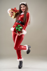 Santa girl bearing presents