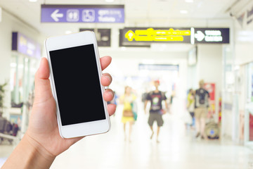 Smart phone with black screen in hand on blurred in airport terminal