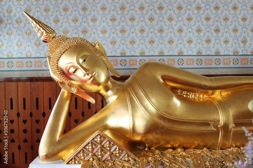A Beautiful Reclining Golden Buddha Statue At Thai Temple Thailand Wall Mural Wootipong A Beautiful Reclining Golden Buddha Statue At Thai Temple Thailand Wall Mural Wootipong