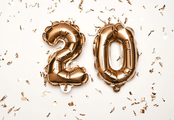 20 golden symbol on white background.