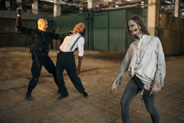 Obraz na płótnie Canvas Military man nightmare, battle with zombie army