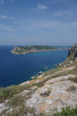 Fototapeta na wymiar View from the island of San Nicola towards the island of Capraia and its abandoned lighthouse. Tremiti islands, Adriatic sea, Puglia, Italy