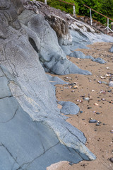 Abstract rocks and sand background. Ocean shore in Vancouver, Canada.