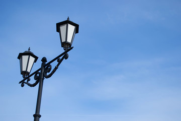 street lamp and clear blue sky.