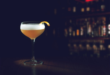 Whiskey Sour Cocktail - Bourbon with Lemon Juice, Sugar Syrup and Egg White in a special glass with...