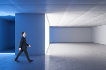 Fototapeta premium Businessman walking in gallery interior