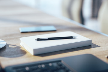 Office table with empty notepad
