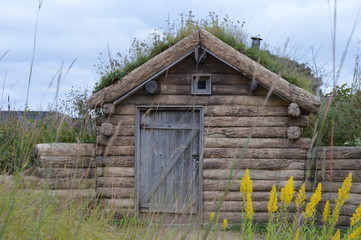 Sod house on the prairie during summer