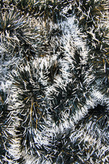 Black and white Christmas tinsel decoration, xmas texture, full frame background, holiday concept