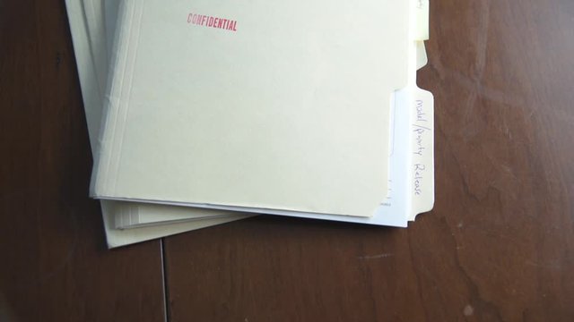 Confidential Folders Slapped Onto Table 60fps