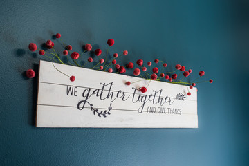 we gather together and give thanks sign on the wall