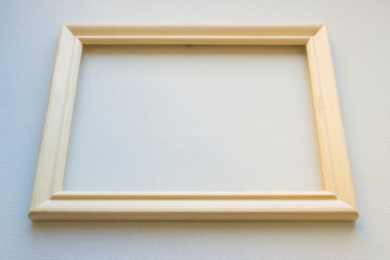 Wooden frame on white canvas