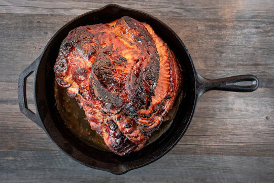 Rustic Holiday Honey Glazed Baked Ham In Cast Iron Pan Flat Lay