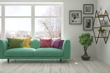 Stylish room in white color with sofa and winter landscape in window. Scandinavian interior design. 3D illustration