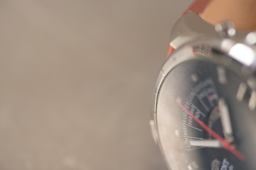 Mens steel watch with brown strap closeup. Perpetual calendar, world time ,automatic. Copy space.