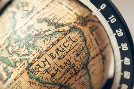 Vintage globe closeup, located on America. Concept for travel commercial.
