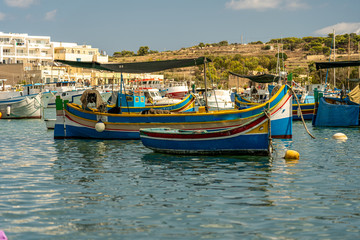 Fototapeta na wymiar view of the harbor with boats, of marsaxlokk on malta