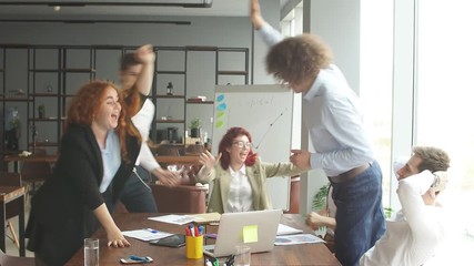 Corporate employees reacting strongly to positive news of their company's achievements. Male and female staff members excited and surprised