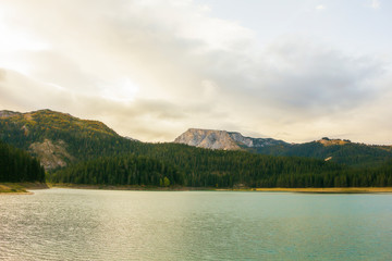 Different views of the glacial Black lake (Crno jezero), forest and mountains around in the national park Durmitor in Montenegro, Europe