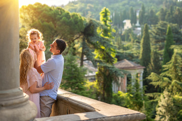 Family, mom, dad, daughter n walk in the old church.
