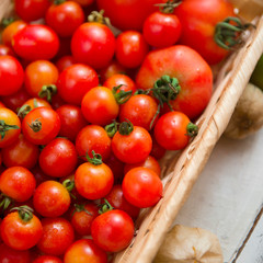 Close up of small cherry tomatoes in wooden box