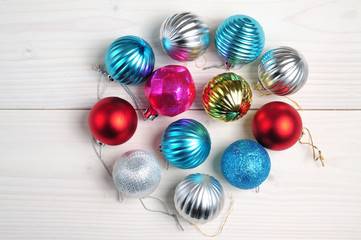 Christmas and New Year`s balls of shiny color on a white background