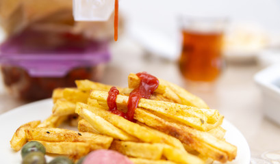 fried potatoes and spill ketchup on it
