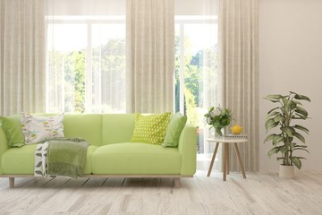 Stylish room in white color with sofa and summer landscape in window. Scandinavian interior design. 3D illustration