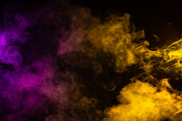 Purple and yellow cloudy smoke on black background