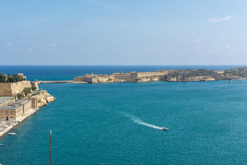 Fototapeta na wymiar View at bay entrance between Valletta and three cities in Malta