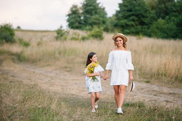 Young mother and her daughter have fun, mother's Day.