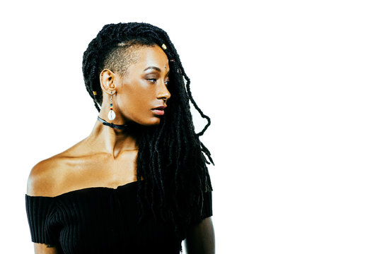 Profile portrait of an African American woman with dreadlocks looking to side isolated in studio