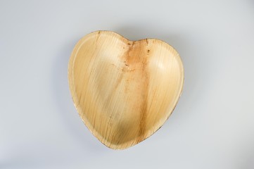 Eco friendly disposable plates and cups made from palm leaf as party plastic alternative for an eco-friendly environment