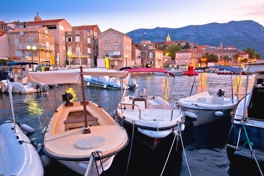 Town of Korcula coastline and harbor colorful dusk view,