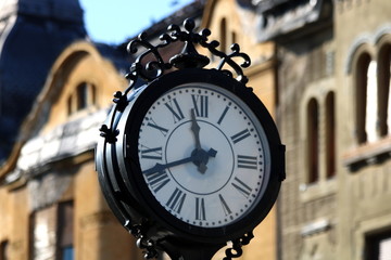Fototapeta na wymiar Old Street Clock In Europe.Architecture Element In The Main Square