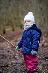 Little girl outdoors in winter  nature portrait emotion