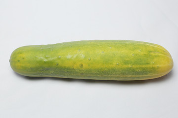 withered cucumber with green and yellow color on white background