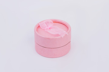 Pink jewelry gift box isolated. Closed jewellery box on gray background. Birthday gift concept.